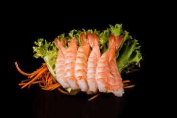 roll with shrimp close-up. Shrimp roll isolated on black background