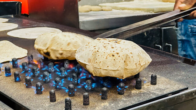 Hot rotis have just been prepared on the gas in dhaba