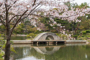 Kokokyo Bridge (Straddling Rainbow bridge) in Shukkei-en or Shukkeien Japanese garden. Hiroshima...