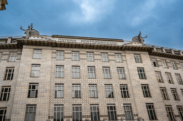 Vienna, Austria, August 21, 2022. Beautiful shot with the facade of the Österreichische Postsparkasse, a modern post office. On the roof two angels.