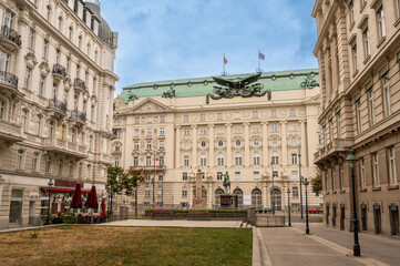 Fototapeta premium Vienna, Austria, August 21, 2022. Nice shot with the facade showing the large eagle of the former Imperial and Royal Ministry of War, now home to several federal ministries. No people.