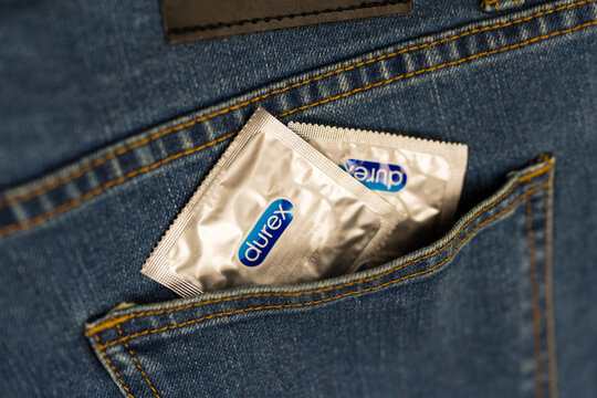 Samut Prakan, Thailand - July 19, 2024 : Two condom Durex in pocket of blue jeans.