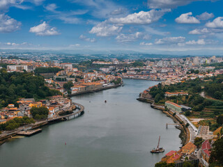 Fototapeta premium Aerial view of the European city Porto with Luis I Bridge over Douro river in Portugal, aerial view. Panoramic aerial view of Dom Luis Bridge in Porto