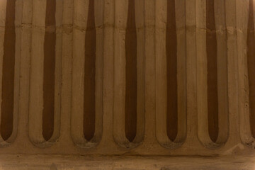 imagen detalle textura pared de piedra con relieves y sombras 