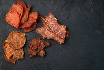 Mix of dried meat Jerky . From chicken , beef and pork.