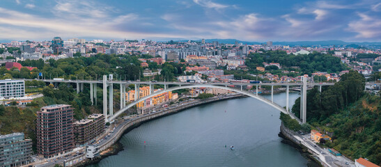 Obraz premium Aerial view of the European city Porto with Luis I Bridge over Douro river in Portugal, aerial view. Panoramic aerial view of Dom Luis Bridge in Porto