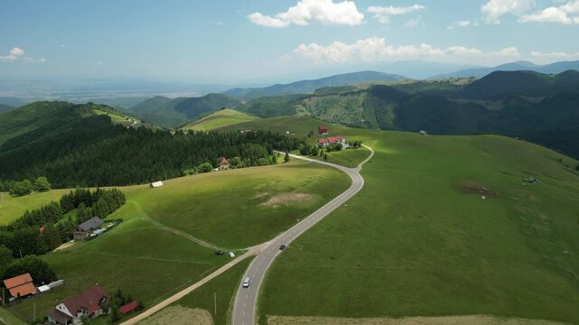 Aerial drone view above the mountain road in Paltinis, in the Carpathian Mountains, Romania.