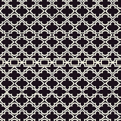 Elegant black and white quatrefoil pattern forming horizontal lines