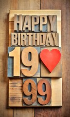 happy birthday greeting card - text in vintage letterpress wood type with a heart tangram