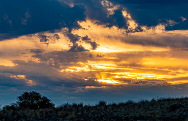 Sunrise through heavy cloud layer
