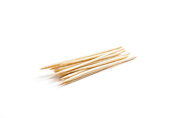 Close-up of wooden toothpicks on a white background