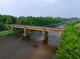 Fototapeta premium Preston, Lancashire, UK, May 31, 2024; aerial view of old footbridge, Avenham Miller Park, off Winckley Square, Preston, Lancashire, England, UK. 