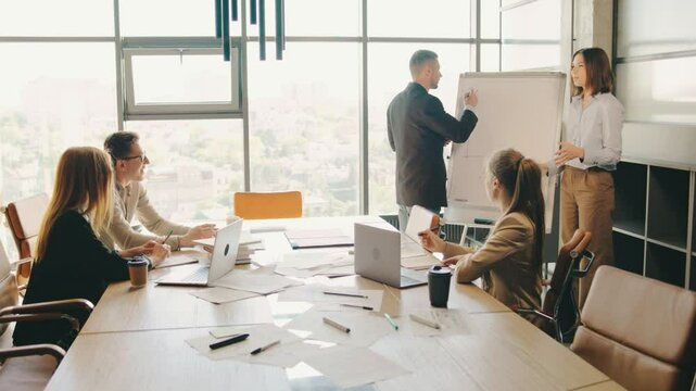 During a productive business meeting in a modern office setting, collaboration and innovation were fostered among skilled team members, promoting teamwork in a corporate environment