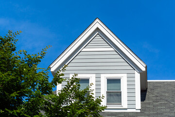 Close-Up View of a Gabled Dormer Window on the Sloped Roof of a Newly Built House, Brighton, Massachusetts, USA
