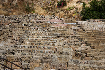 Ancient ruins of Roman Theater (El Teatro Romano) at foot of famous Malaga Alcazaba fortress, was built in the XI century. Malaga, Andalusia, Spain.