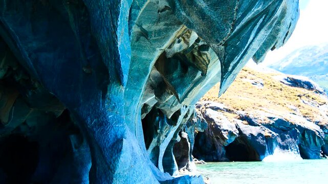 Slowling moving into a cave at the Marble Caves and through the cave Cuevas de M&aacute;rmol.