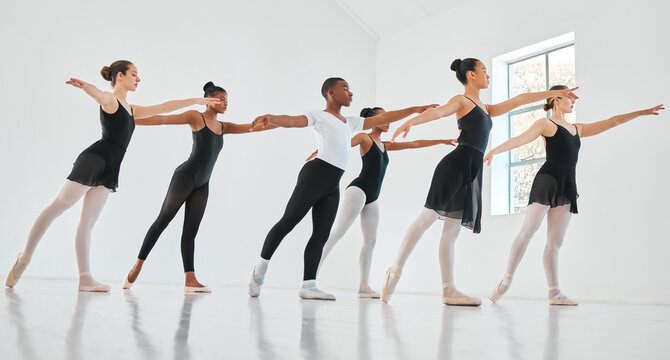 People, ballet and row with dancers in class for balance, art or performance in practice studio. Young group, team or performers in line or artist with talent, elegance or training for choreography