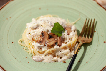 Spaghetti pasta with mushroom white cream sauce.  Italian food style