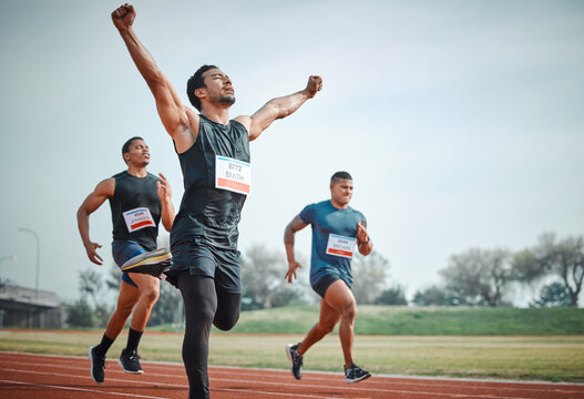 Race, winning and group of men on track for speed challenge, marathon event and celebration. Success, achievement and athlete at stadium for competition, fitness and running champion with arms up