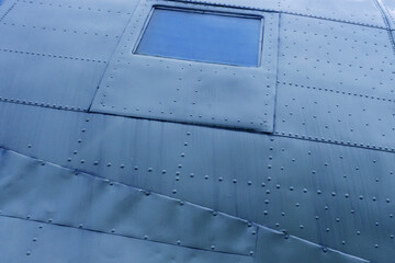 Window of the fuselage of an old airplane.