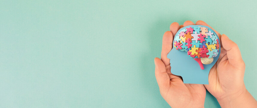 ADHD awareness month october, attention deficit hyperactivity disorder, mental health, head of a child with colorful jigsaw or puzzle pieces 