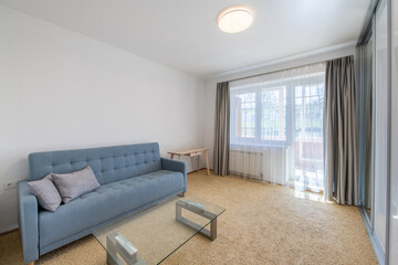 Minimalism Children, Young Adult Living Room Interior. Couch and Table. Windows and Curtains. Coffee Table, Carpet