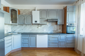 Classic Home Kitchen Interior. Wooden Floor, Oven, Kettle, Gas Heater. Minimalistic Interior Design