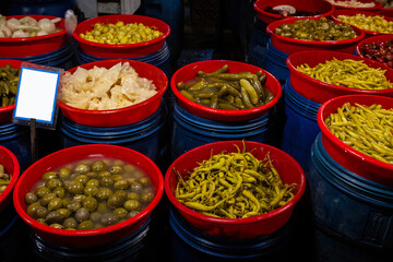 Different fruit and vegetable pickles at a farmers' market in Turkey.