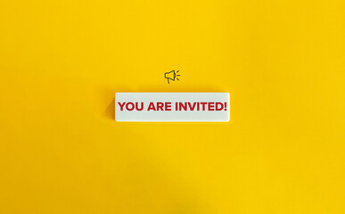 You are invited Banner. Megaphone Icon and Red Text on Block Letter Tile against Yellow Background.