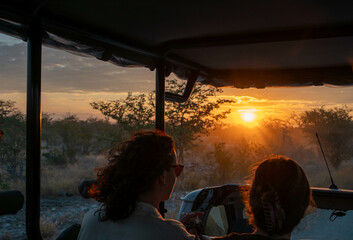 sunset safari in etosha national park, namibia © Kris