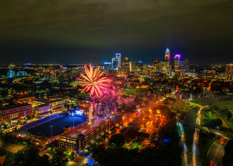 Aerial view of Charlotte at night with fireworks