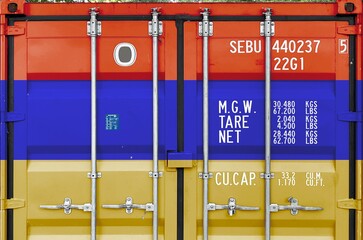 Armenia flag depicted on metal doors of shipping cargo container outdoors in docks area close up