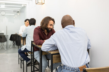 Engaging discussion between colleagues at English academy