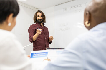 Group of professionals engaged in a dynamic classroom discussion