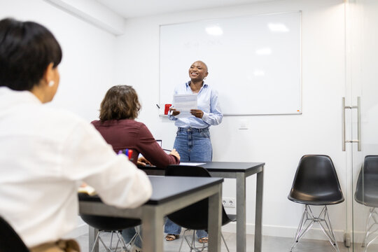 African American woman leading a discussion in a classroom