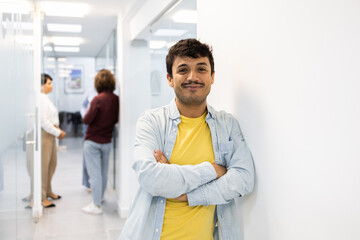 Smiling man and colleagues in modern English academy