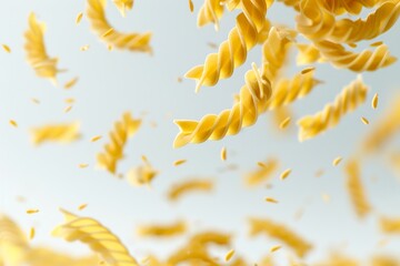 Close-up of fusilli pasta falling against a white background