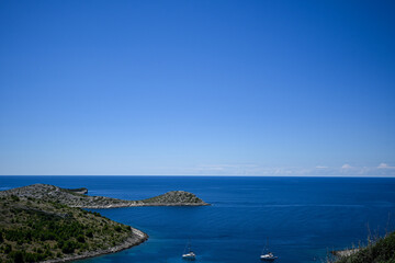 Beautiful landscape of kornati national park in croatia showing turquoise water on a sunny day with white clouds