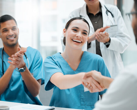 Happy woman, clapping or doctors shaking hands for promotion, good job or interview success in meeting. People, congratulations or proud healthcare worker with manager for medical help or teamwork