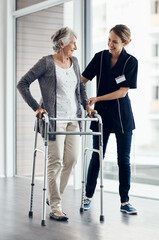 Help, caregiver and elderly woman with walker for assistance, support or medical care in retirement...