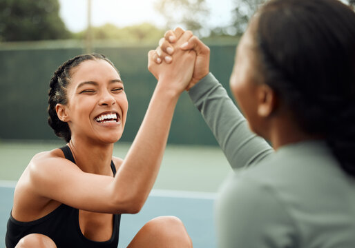 Happy, fitness and friends high five in court or outdoor training in park for workout, exercise or practice. Break, women and people with support or health in celebration of challenge or performance