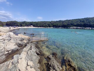 Boats in the bay - blue waters at the Adriatic sea shore - Croatia 