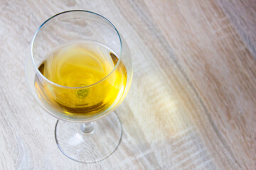 Wine in a glass on the table. Drink on a wooden table,kitchen,product,preparation.