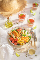 Tasty and homemade salad made of vegetables, meat and fruits.