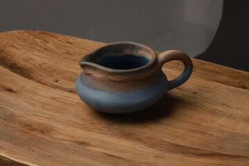 cCay jug on a wooden table