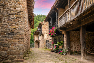Typical street in B&aacute;rcena Mayor, Cantabria, Spain, with typical buildings with wooden balconies and a complex declared of historical-artistic interest