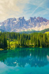At Lake Braies in the morning on holiday in South Tyrol. A mountain in the Alps in the background
