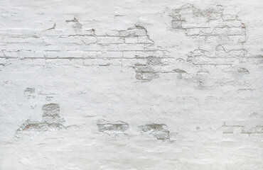 White brick wall background. Weathered plaster texture