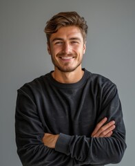 Obraz premium Portrait of handsome smiling young man with folded arms isolated white PNG, Joyful cheerful casual businessman with crossed hands studio shot, Generative AI