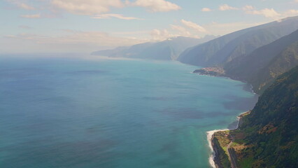 Fototapeta premium Expansive coastline blue ocean creating serene tropical landscape aerial shot.